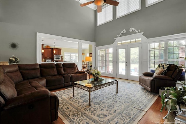 2825 Sand Trap Ln, Hope Mills, NC 28348 - living area with a high ceiling, french doors, a ceiling fan, and wood finished floors