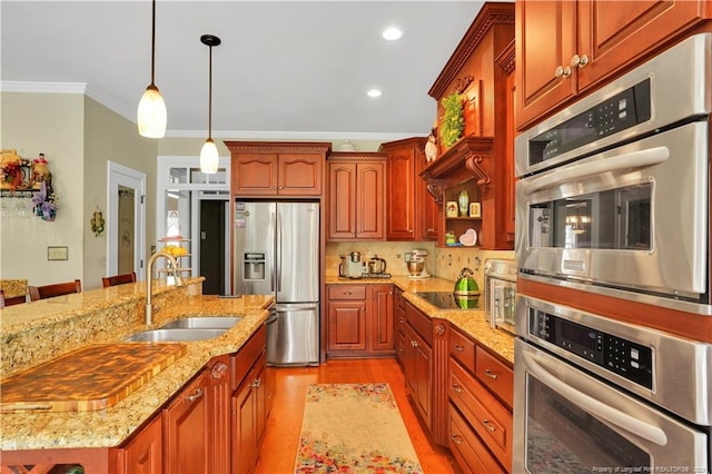 2825 Sand Trap Ln, Hope Mills, NC 28348 - kitchen with appliances with stainless steel finishes, ornamental molding, light wood-style floors, pendant lighting, and light stone counters
