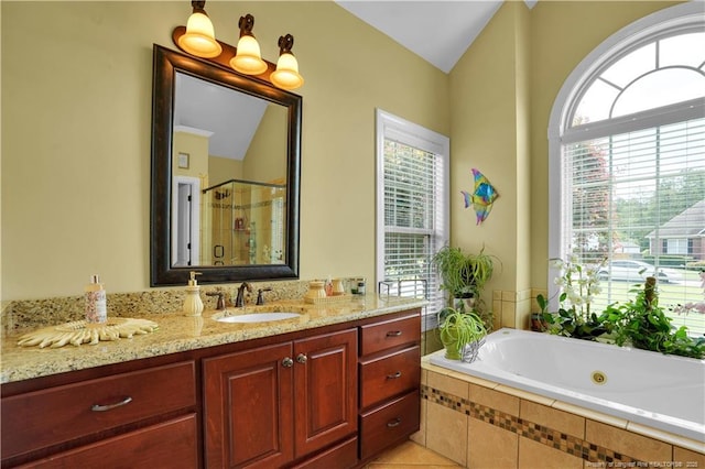2825 Sand Trap Ln, Hope Mills, NC 28348 - full bath with a whirlpool tub, a stall shower, vanity, tile patterned floors, and vaulted ceiling