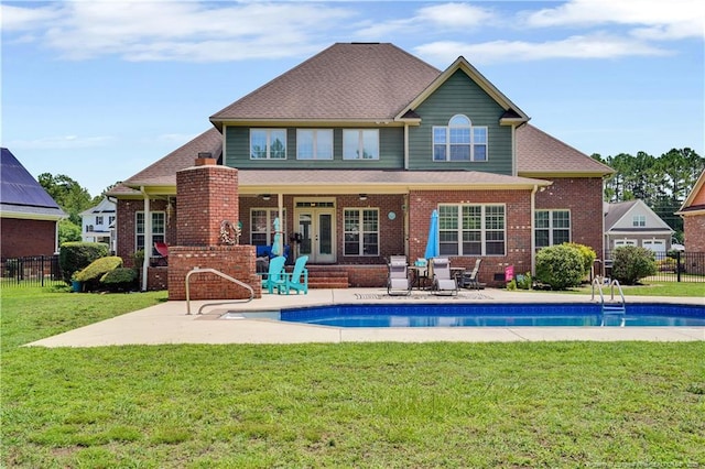 2825 Sand Trap Ln, Hope Mills, NC 28348 - rear view of house with a patio area, brick siding, and french doors