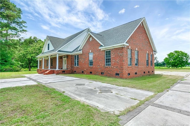 1190 Mckeller Rd, Fairmont, NC 28340 - view of front of home with crawl space, covered porch, a front yard, and brick siding