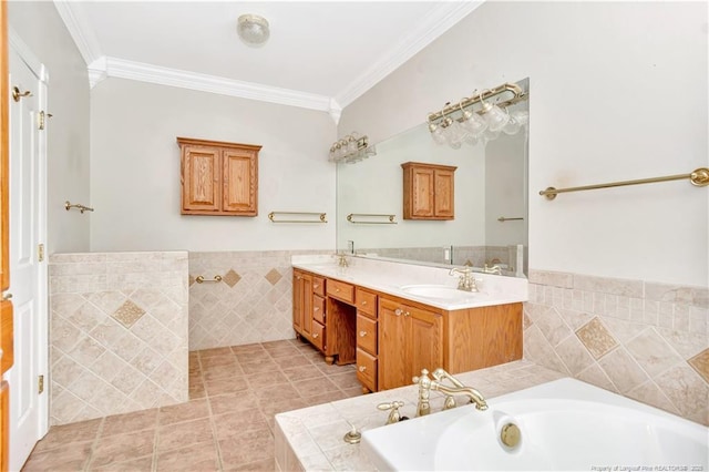 1190 Mckeller Rd, Fairmont, NC 28340 - full bath featuring a bath, crown molding, double vanity, tile walls, and a wainscoted wall