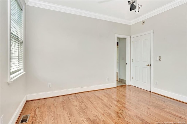 1190 Mckeller Rd, Fairmont, NC 28340 - unfurnished room with light wood-style flooring and ornamental molding