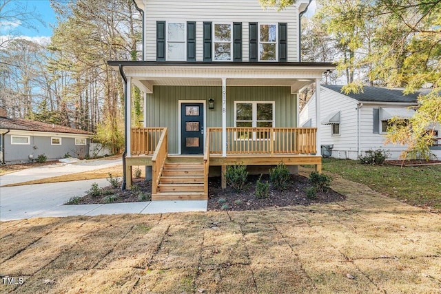 1917 Essex Unit B, Durham, NC 27704 - view of front facade featuring covered porch and board and batten siding