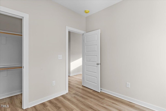 1917 Essex Unit B, Durham, NC 27704 - unfurnished bedroom featuring a closet and wood finished floors