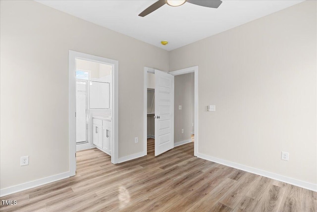 1917 Essex Unit B, Durham, NC 27704 - unfurnished bedroom with light wood finished floors, a spacious closet, ensuite bathroom, a closet, and a ceiling fan
