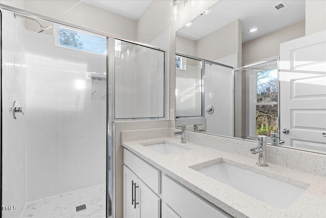 1917 Essex Unit B, Durham, NC 27704 - bathroom featuring a stall shower, double vanity, and recessed lighting