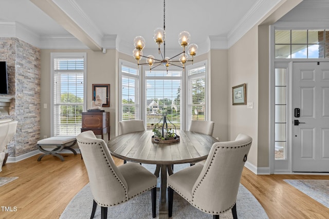 12510 Megan Hill Ct, Raleigh, NC 27614 - dining room with a chandelier, ornamental molding, and light wood finished floors