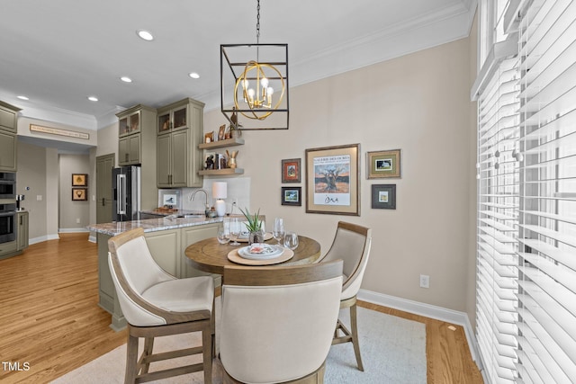 12510 Megan Hill Ct, Raleigh, NC 27614 - dining space featuring ornamental molding, a chandelier, light wood finished floors, and recessed lighting