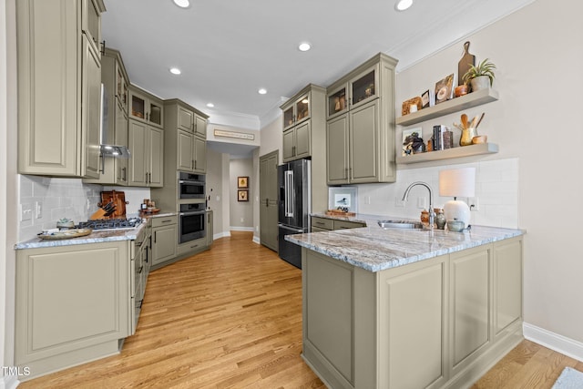12510 Megan Hill Ct, Raleigh, NC 27614 - kitchen featuring high end refrigerator, a peninsula, gray cabinets, ornamental molding, and decorative backsplash