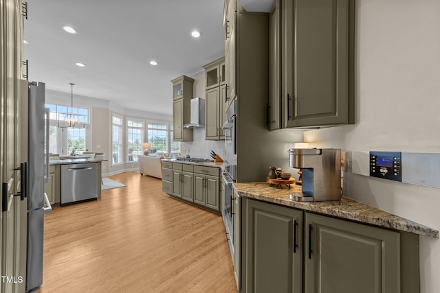 12510 Megan Hill Ct, Raleigh, NC 27614 - kitchen featuring stainless steel appliances, light wood finished floors, wall chimney exhaust hood, recessed lighting, and gray cabinetry