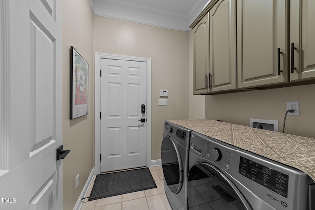 12510 Megan Hill Ct, Raleigh, NC 27614 - washroom featuring washer and clothes dryer, cabinet space, crown molding, and light tile patterned floors