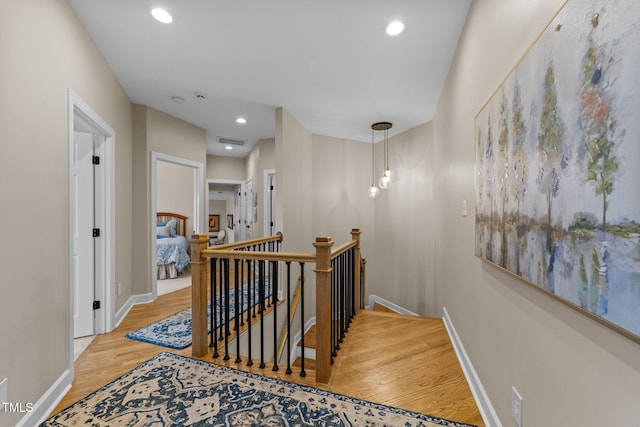 12510 Megan Hill Ct, Raleigh, NC 27614 - corridor with an upstairs landing, wood finished floors, and recessed lighting