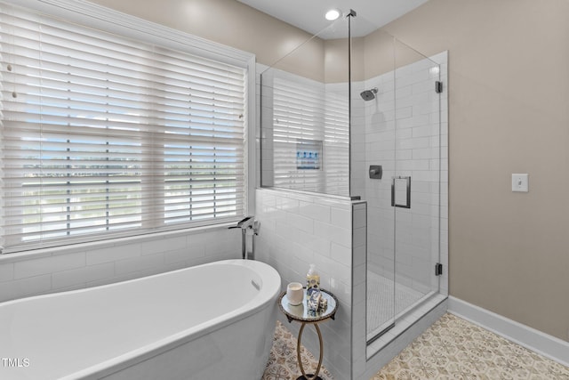 12510 Megan Hill Ct, Raleigh, NC 27614 - full bathroom with a soaking tub, a stall shower, and tile patterned floors