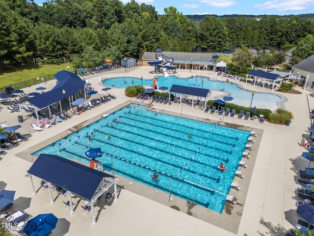 12510 Megan Hill Ct, Raleigh, NC 27614 - community pool featuring a patio area and a forest view