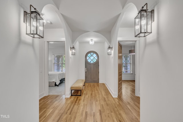 2203 Meadowcreek Dr, Durham, NC 27705 - entrance foyer featuring light wood-style floors and arched walkways