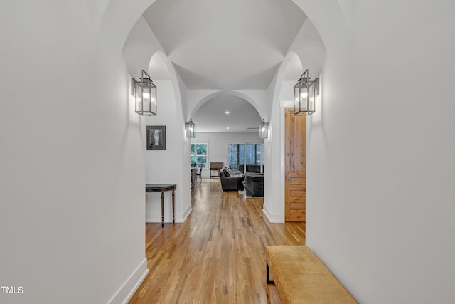 2203 Meadowcreek Dr, Durham, NC 27705 - hall featuring light wood-style floors and arched walkways