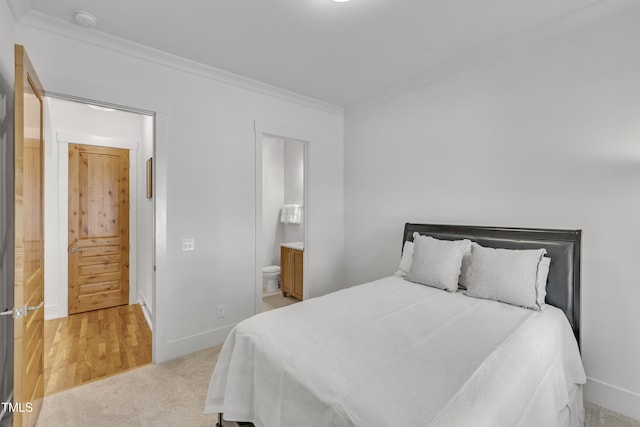 2203 Meadowcreek Dr, Durham, NC 27705 - bedroom with ornamental molding, ensuite bathroom, and light colored carpet