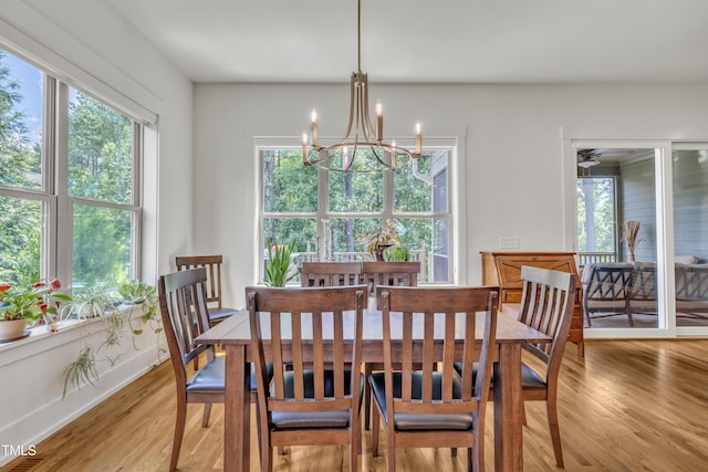 2203 Meadowcreek Dr, Durham, NC 27705 - dining area with a chandelier, healthy amount of natural light, and light wood-style floors
