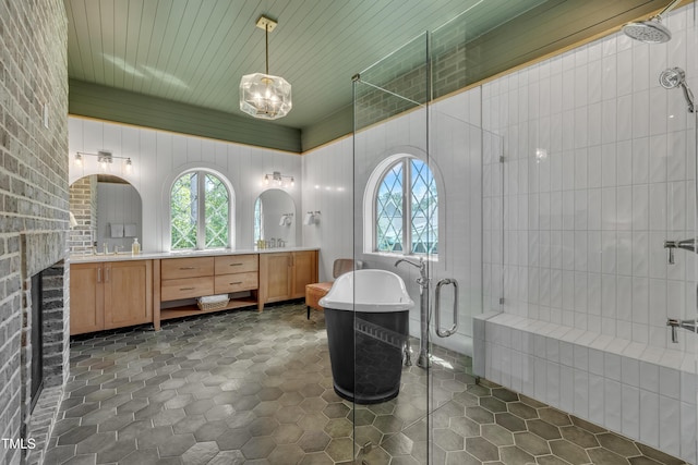 2203 Meadowcreek Dr, Durham, NC 27705 - bathroom with a shower stall, a freestanding tub, and double vanity