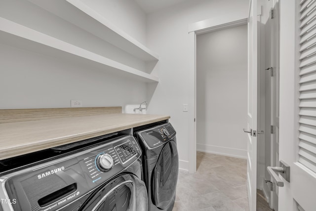 2203 Meadowcreek Dr, Durham, NC 27705 - laundry area featuring washer and clothes dryer and baseboards