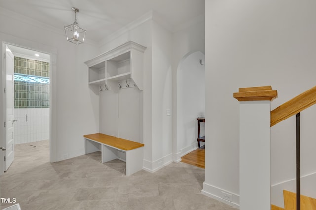 2203 Meadowcreek Dr, Durham, NC 27705 - mudroom featuring ornamental molding, arched walkways, and tile patterned flooring