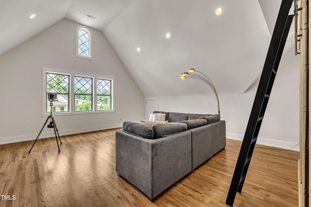 2203 Meadowcreek Dr, Durham, NC 27705 - living area featuring vaulted ceiling, light wood finished floors, and recessed lighting