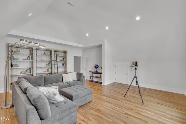 2203 Meadowcreek Dr, Durham, NC 27705 - living area featuring lofted ceiling, light wood-style floors, and recessed lighting