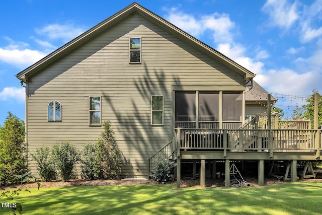 2203 Meadowcreek Dr, Durham, NC 27705 - back of house featuring a wooden deck, a lawn, and a sunroom