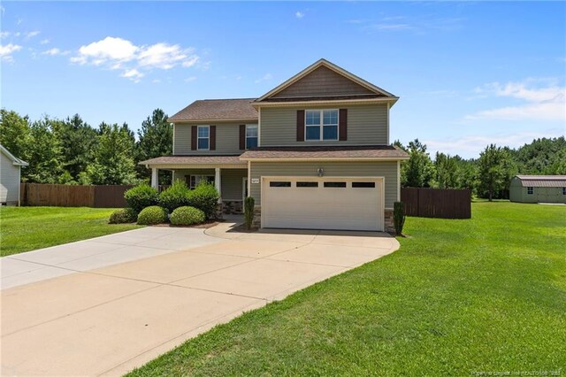 6204 Yorkie Ct, Stedman, NC 28391 - craftsman-style house featuring a garage, driveway, and stone siding