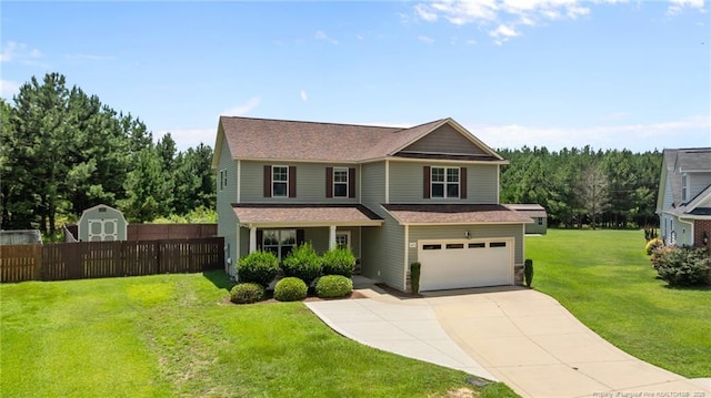 6204 Yorkie Ct, Stedman, NC 28391 - view of front facade featuring a garage, driveway, and a storage shed
