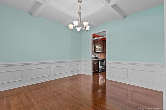 6204 Yorkie Ct, Stedman, NC 28391 - unfurnished dining area featuring a chandelier, a wainscoted wall, beam ceiling, dark wood-type flooring, and coffered ceiling