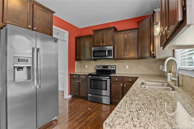 6204 Yorkie Ct, Stedman, NC 28391 - kitchen with appliances with stainless steel finishes, dark wood-type flooring, light stone counters, and backsplash