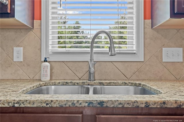 6204 Yorkie Ct, Stedman, NC 28391 - kitchen view of tasteful backsplash and light stone countertops