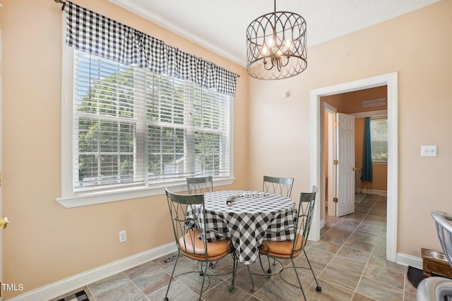 683 Castleberry Rd, Clayton, NC 27527 - dining space featuring a chandelier and baseboards