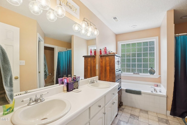 683 Castleberry Rd, Clayton, NC 27527 - full bathroom featuring a bath, double vanity, a shower with shower curtain, and a chandelier