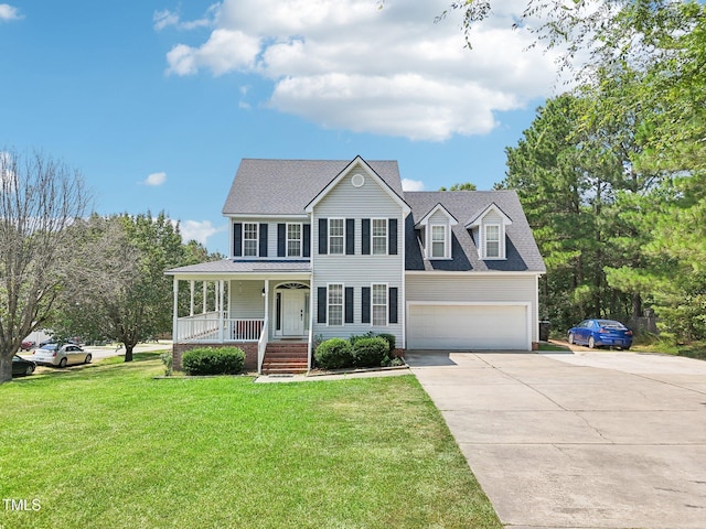 683 Castleberry Rd, Clayton, NC 27527 - colonial home with concrete driveway, covered porch, a front lawn, and roof with shingles
