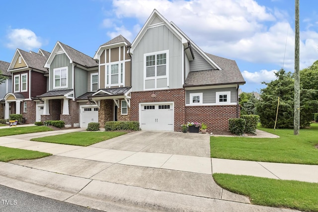 669 Fallon Grove Way, Raleigh, NC 27608 - view of front of home with board and batten siding, brick siding, concrete driveway, a garage, and a front yard