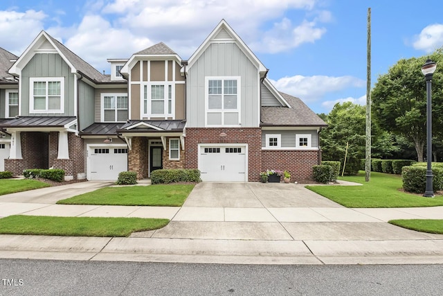 669 Fallon Grove Way, Raleigh, NC 27608 - view of front facade featuring board and batten siding, driveway, brick siding, and a garage