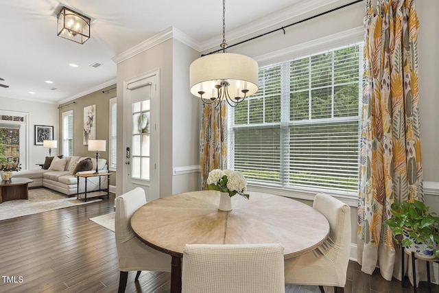 669 Fallon Grove Way, Raleigh, NC 27608 - dining area with plenty of natural light, dark wood-style floors, ornamental molding, a chandelier, and recessed lighting