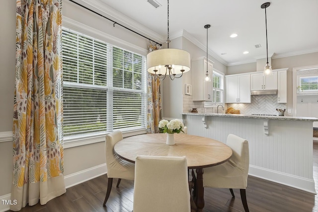 669 Fallon Grove Way, Raleigh, NC 27608 - dining room featuring dark wood-type flooring, ornamental molding, recessed lighting, and a chandelier