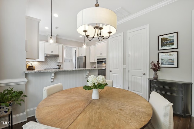 669 Fallon Grove Way, Raleigh, NC 27608 - dining room with crown molding, dark wood-style flooring, and recessed lighting
