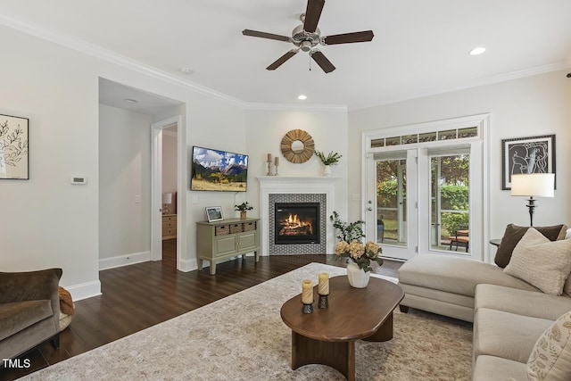 669 Fallon Grove Way, Raleigh, NC 27608 - living room with dark wood-style flooring, a ceiling fan, crown molding, a fireplace, and recessed lighting