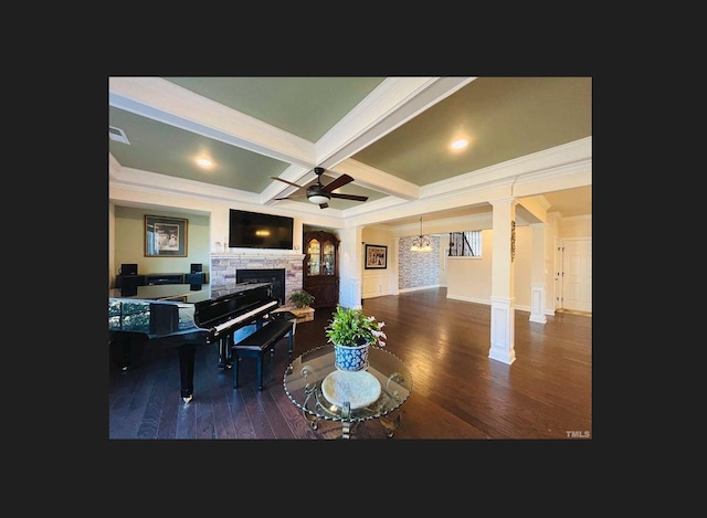 1869 Blue Jay Pt, Apex, NC 27502 - living area with ornate columns, a stone fireplace, wood finished floors, crown molding, and ceiling fan