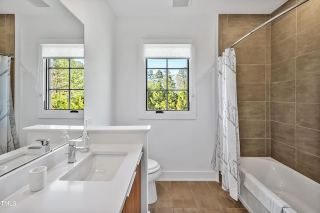 5040 Shakori Trl, Durham, NC 27707 - bathroom with vanity, healthy amount of natural light, shower / tub combo, and tile patterned flooring