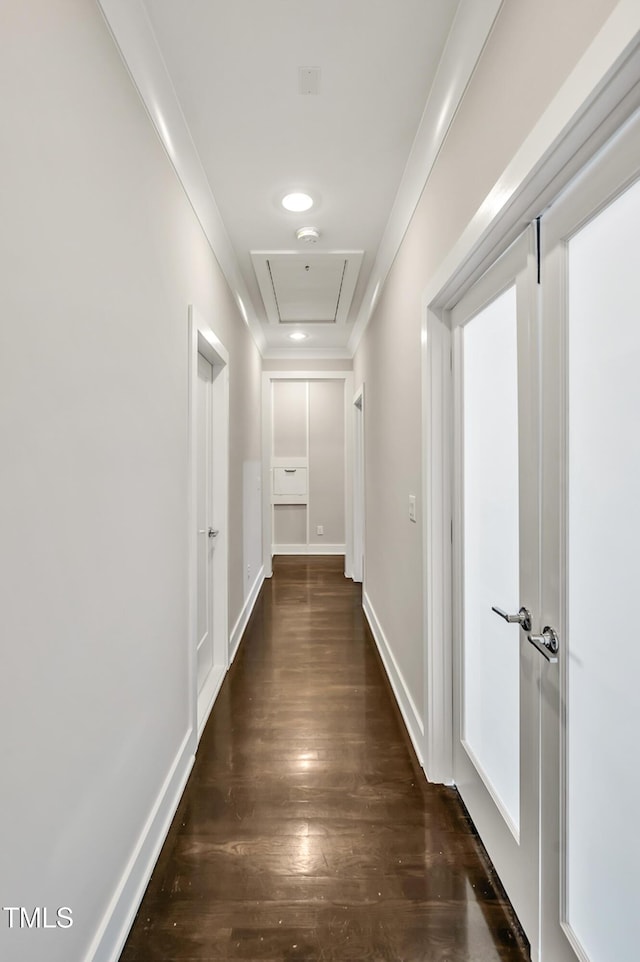 5040 Shakori Trl, Durham, NC 27707 - hallway featuring wood finished floors, attic access, and ornamental molding