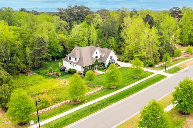 5040 Shakori Trl, Durham, NC 27707 - aerial view of property and surrounding area with a heavily wooded area