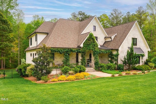 5040 Shakori Trl, Durham, NC 27707 - view of front of home featuring a shingled roof, a porch, a standing seam roof, stucco siding, and a metal roof