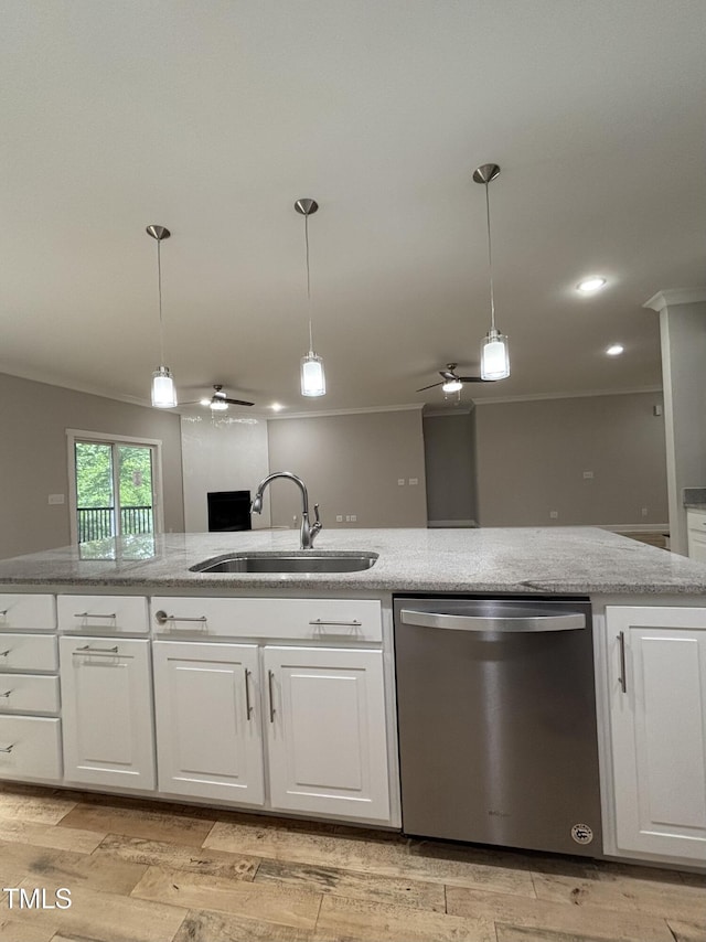 1119 Sagamore Dr, Louisburg, NC 27549 - kitchen with stainless steel dishwasher, a ceiling fan, crown molding, white cabinetry, and light stone countertops