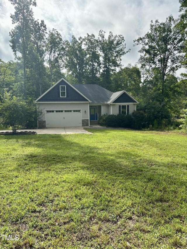 1119 Sagamore Dr, Louisburg, NC 27549 - view of front of home with an attached garage and a front yard